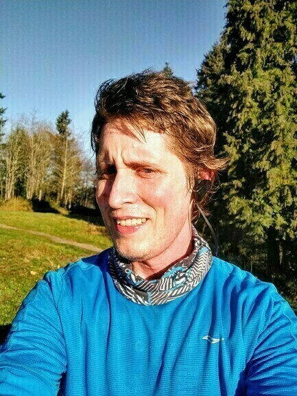 Picture of Ben Patterson in running clothes and scarf